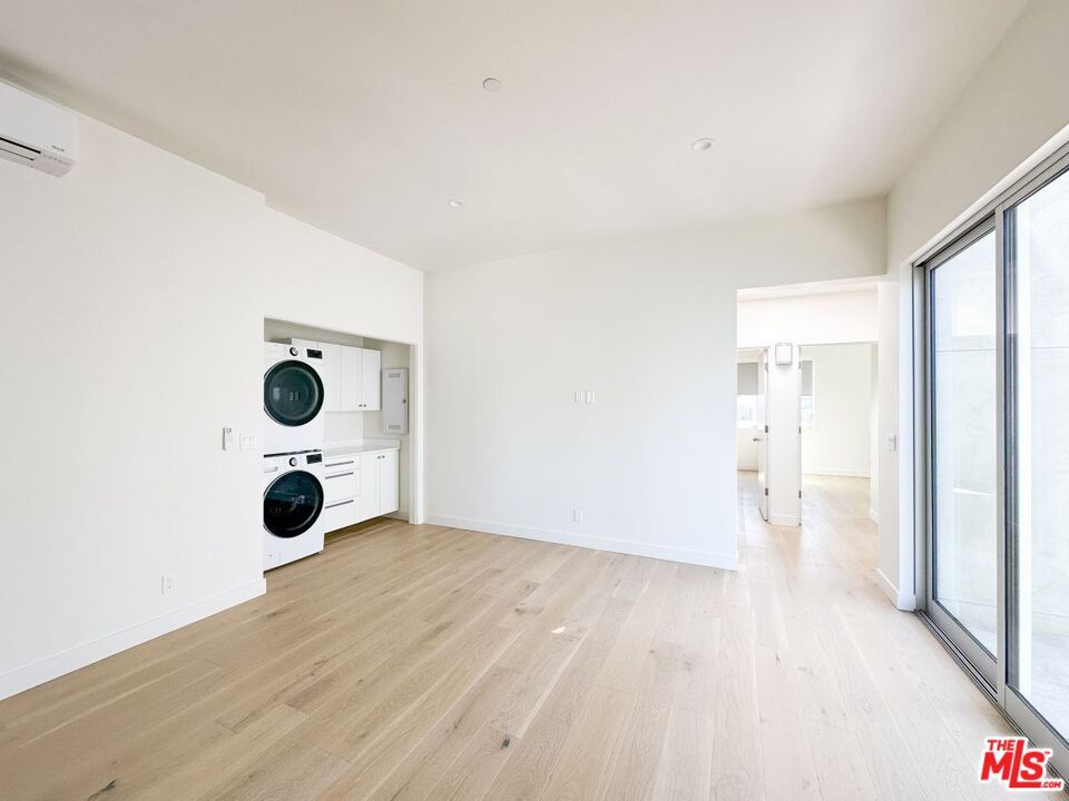 Empty room, Interior, Recessed Lighting, Utility Closets, Washer, Wood Texture Flooring