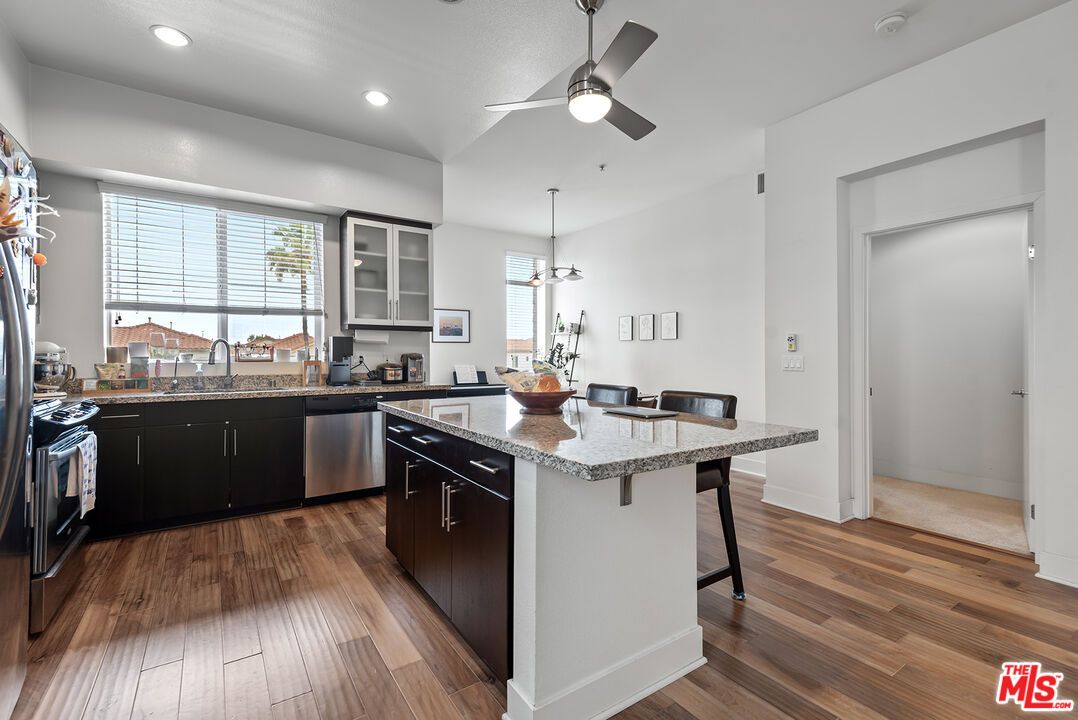 Dining room, Interior, Kitchen, Recessed Lighting, Stainless Steel Appliances, Wood Texture Flooring
