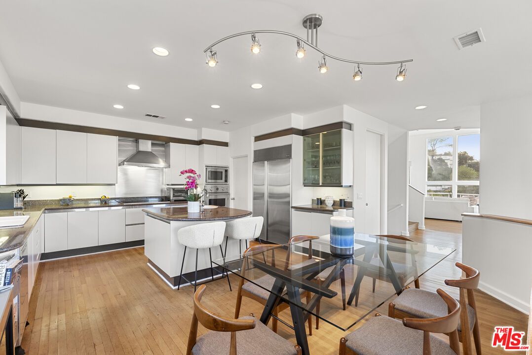 Dining room, Interior, Kitchen, Recessed Lighting, Stainless Steel Appliances, Wood Texture Flooring