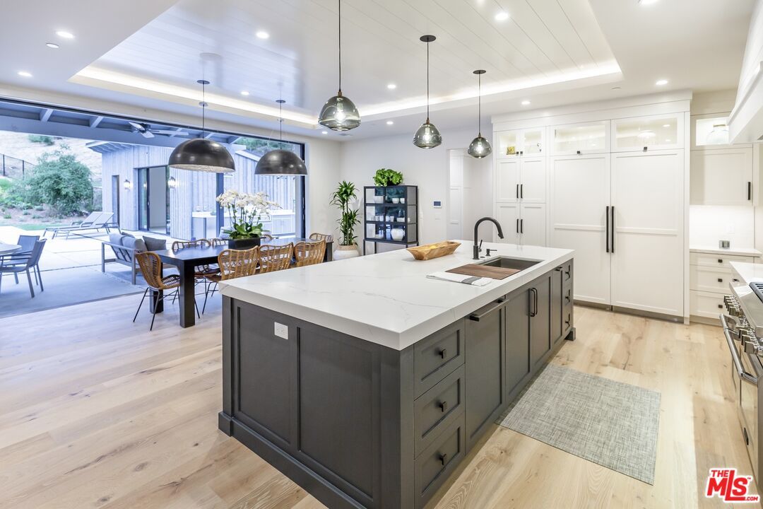 Dining room, Interior, Kitchen, Pendant Lights, Recessed Lighting, Stainless Steel Appliances, Wood Texture Flooring