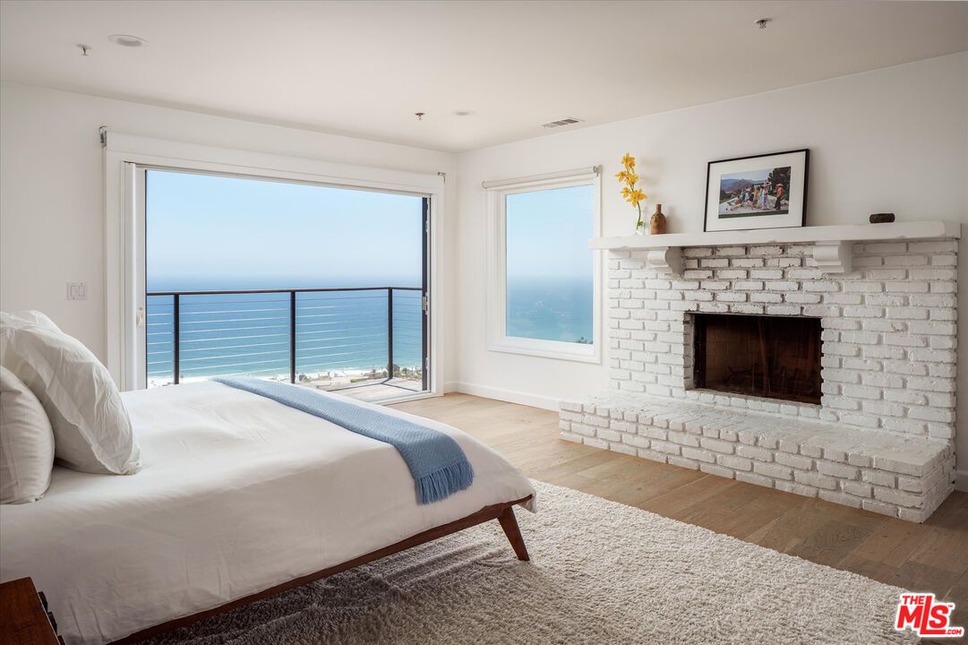 Bedroom, Fireplace, Interior, Recessed Lighting, Water, Wood Texture Flooring