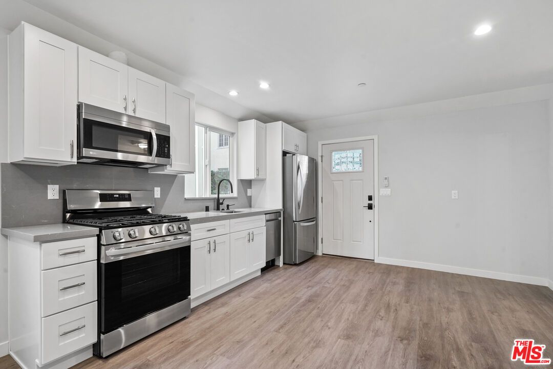 Interior, Kitchen, Recessed Lighting, Stainless Steel Appliances, Wood Texture Flooring