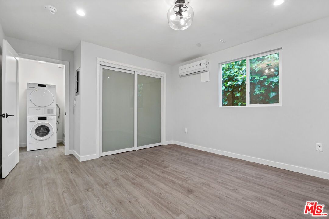 Empty room, Interior, Recessed Lighting, Utility Closets, Washer, Wood Texture Flooring