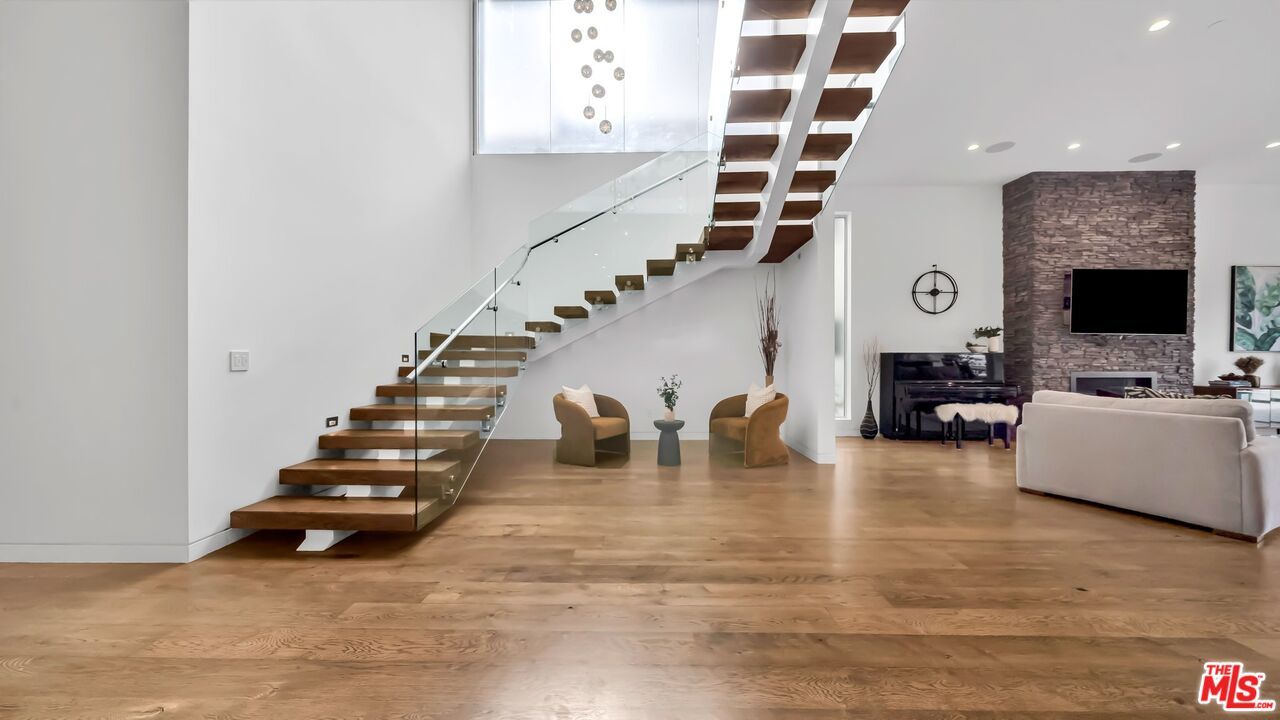 Fireplace, Interior, Living room, Recessed Lighting, Stone Walls, Wood Texture Flooring