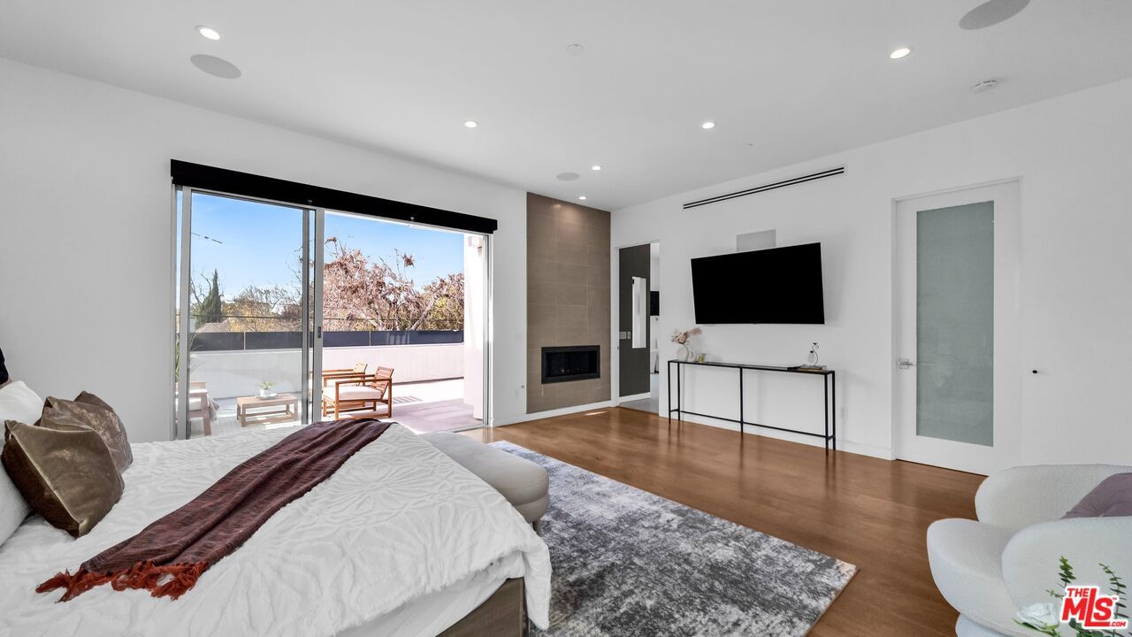 Bedroom, Fireplace, Interior, Recessed Lighting, Wood Texture Flooring