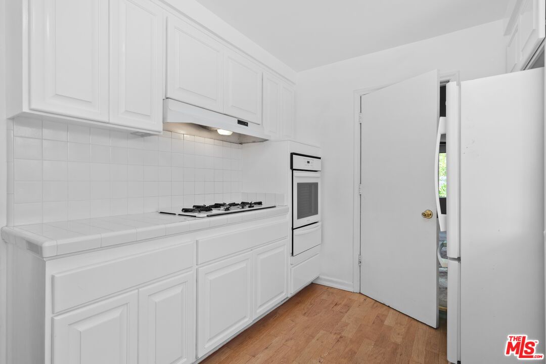 Interior, Kitchen, Tile Countertops, Wood Texture Flooring