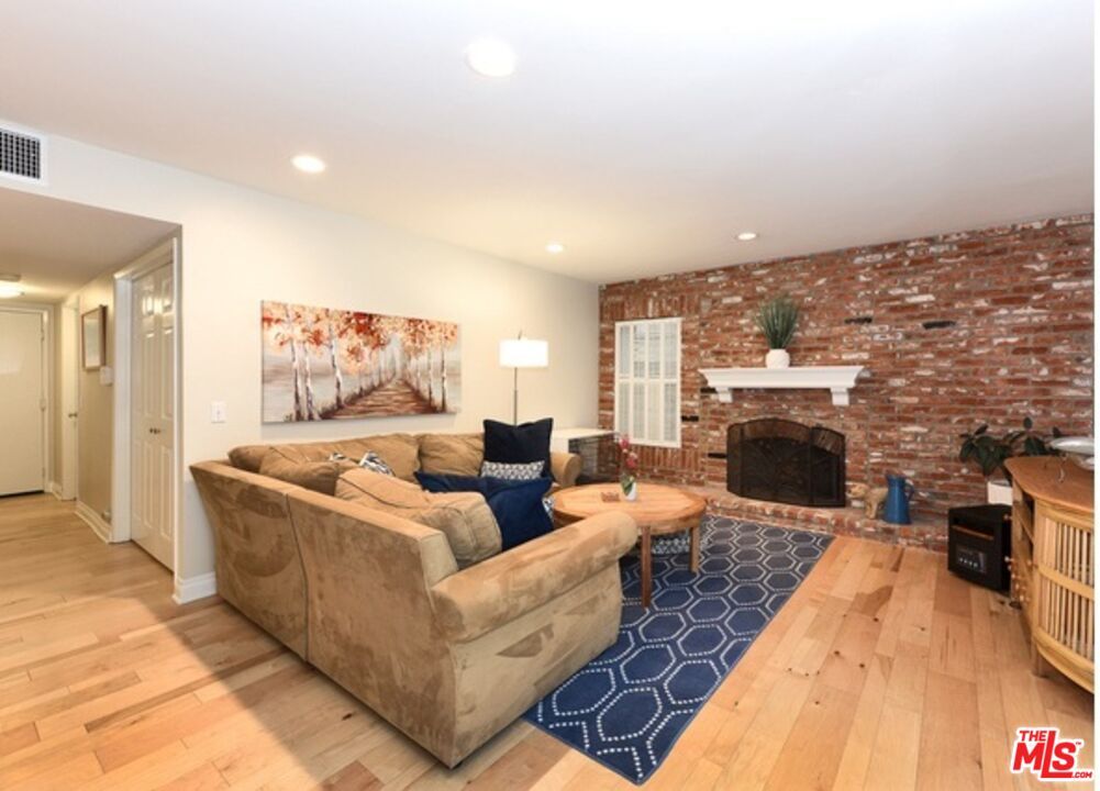 Fireplace, Interior, Living room, Recessed Lighting, Stone Walls, Wood Texture Flooring