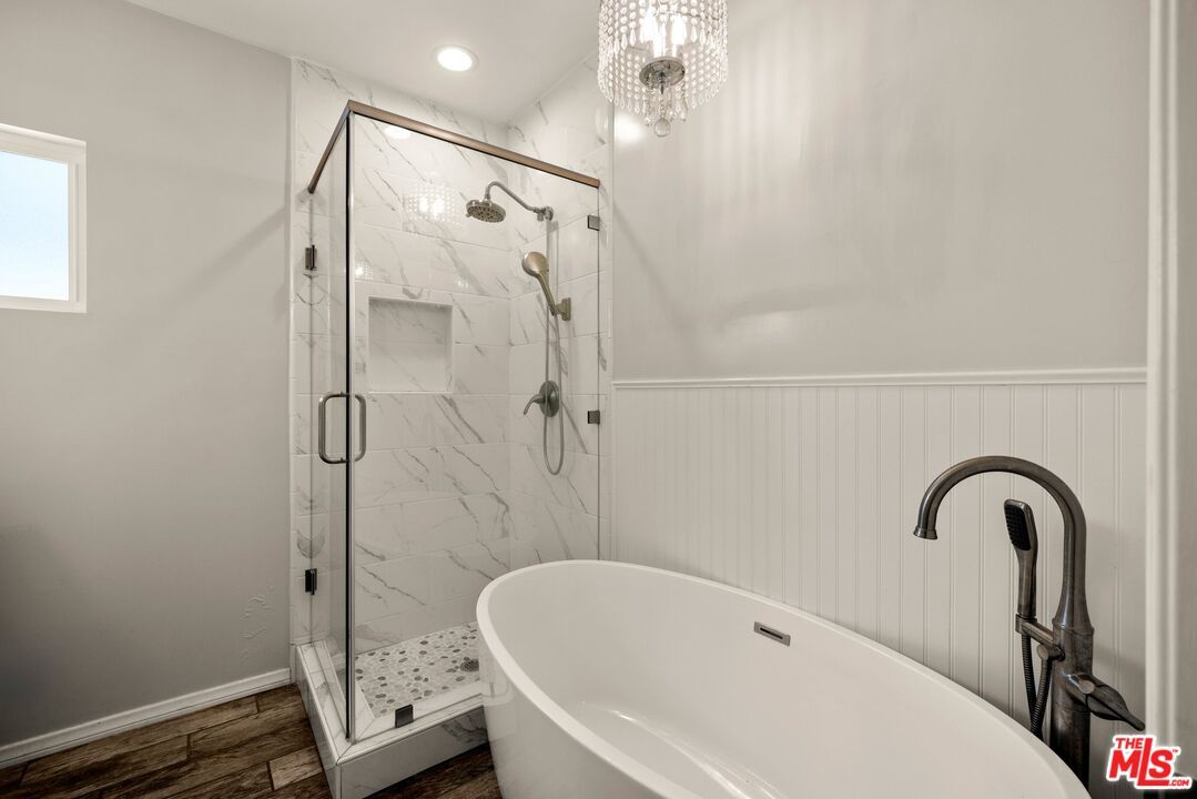 Bathroom, Free Standing Baths, Glass Shower, Interior, Marble Walls, Recessed Lighting, Wood Texture Flooring