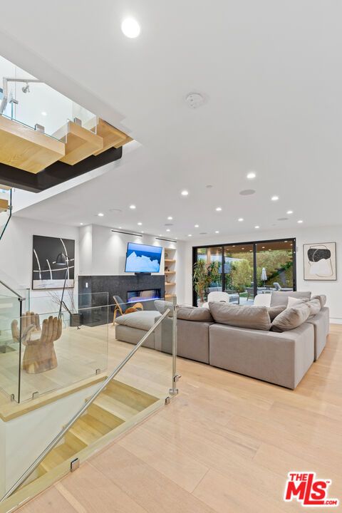 Fireplace, Interior, Living room, Recessed Lighting, Wood Texture Flooring
