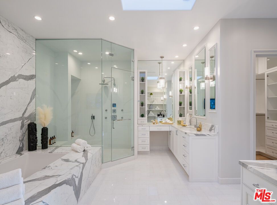 Bathroom, Dual Sink Vanities, Glass Shower, Interior, Marble, Marble Walls, Pendant Lights, Recessed Lighting