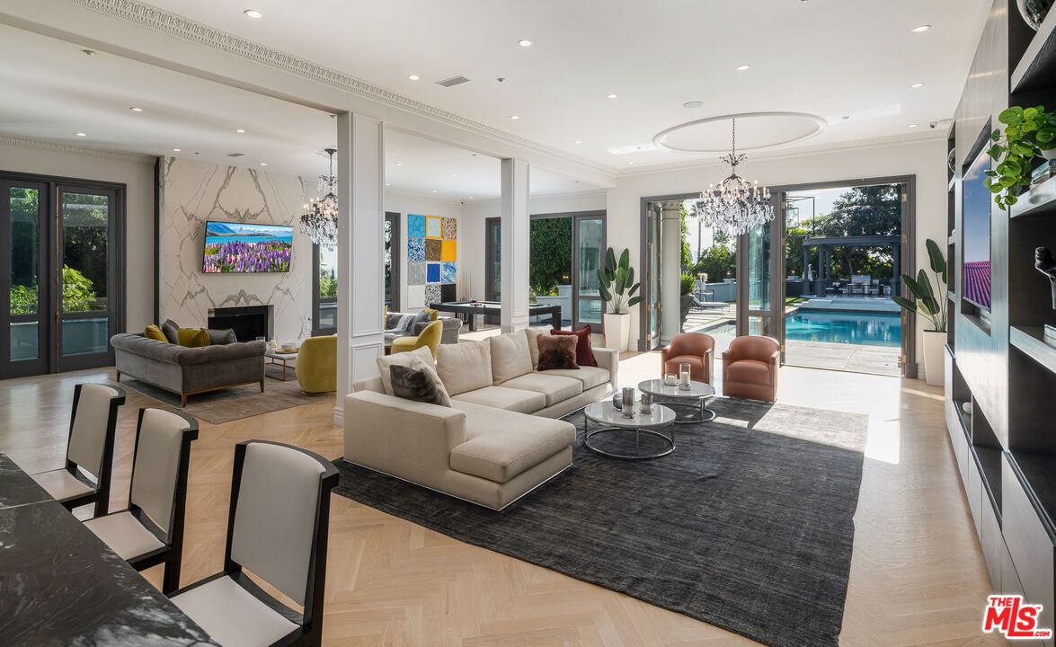 Chandelier, Fireplace, Interior, Living room, Marble Walls, Recessed Lighting, Wood Texture Flooring