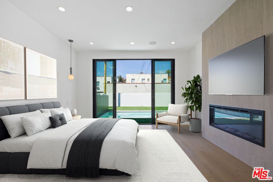 Bedroom, Fireplace, Interior, Pendant Lights, Recessed Lighting, Wood Texture Flooring