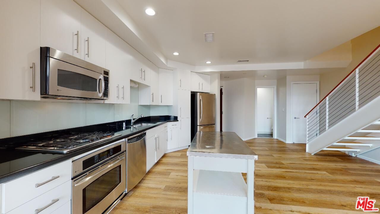 Interior, Kitchen, Recessed Lighting, Stainless Steel Appliances, Wood Texture Flooring