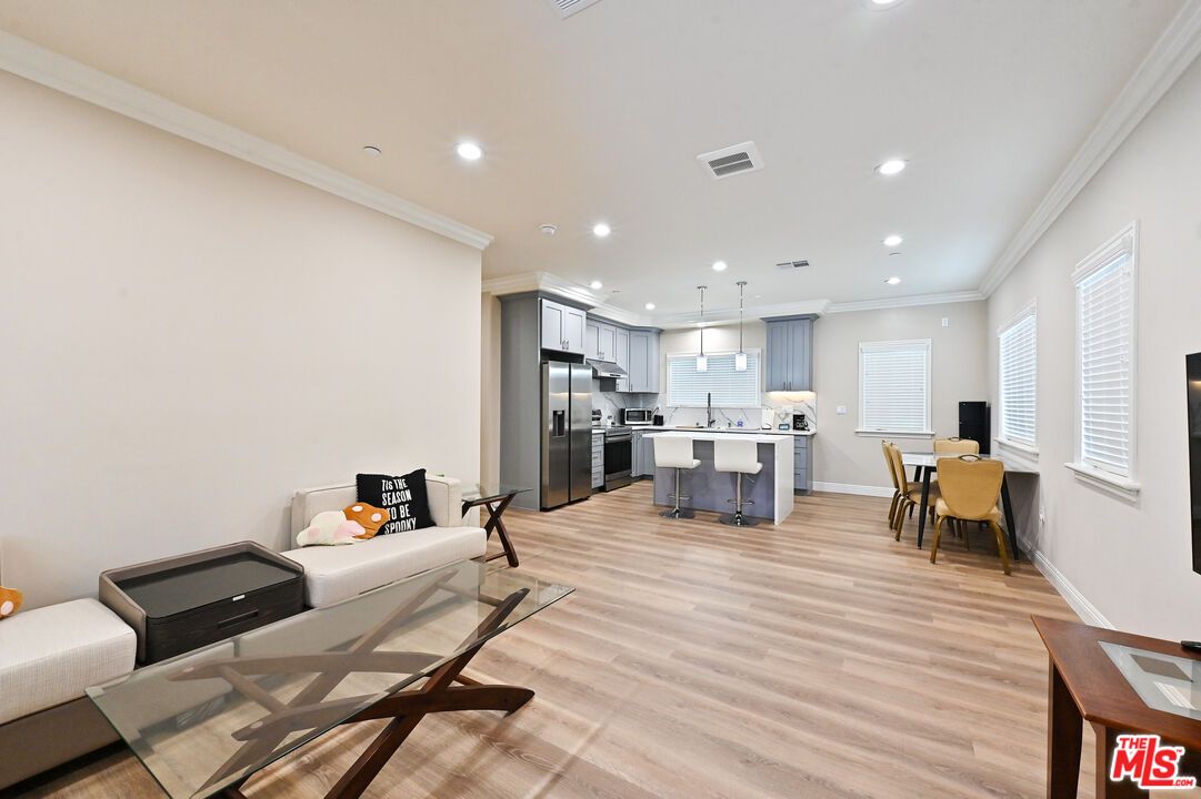 Dining room, Interior, Kitchen, Pendant Lights, Recessed Lighting, Stainless Steel Appliances, Wood Texture Flooring