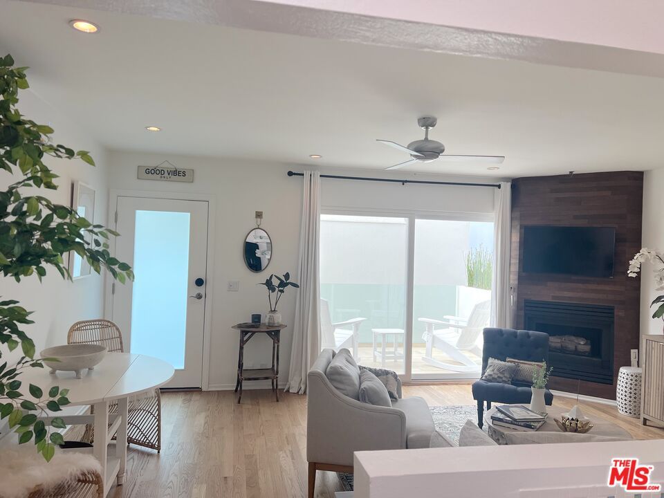 Dining room, Fireplace, Interior, Living room, Recessed Lighting, Water, Wood Texture Flooring