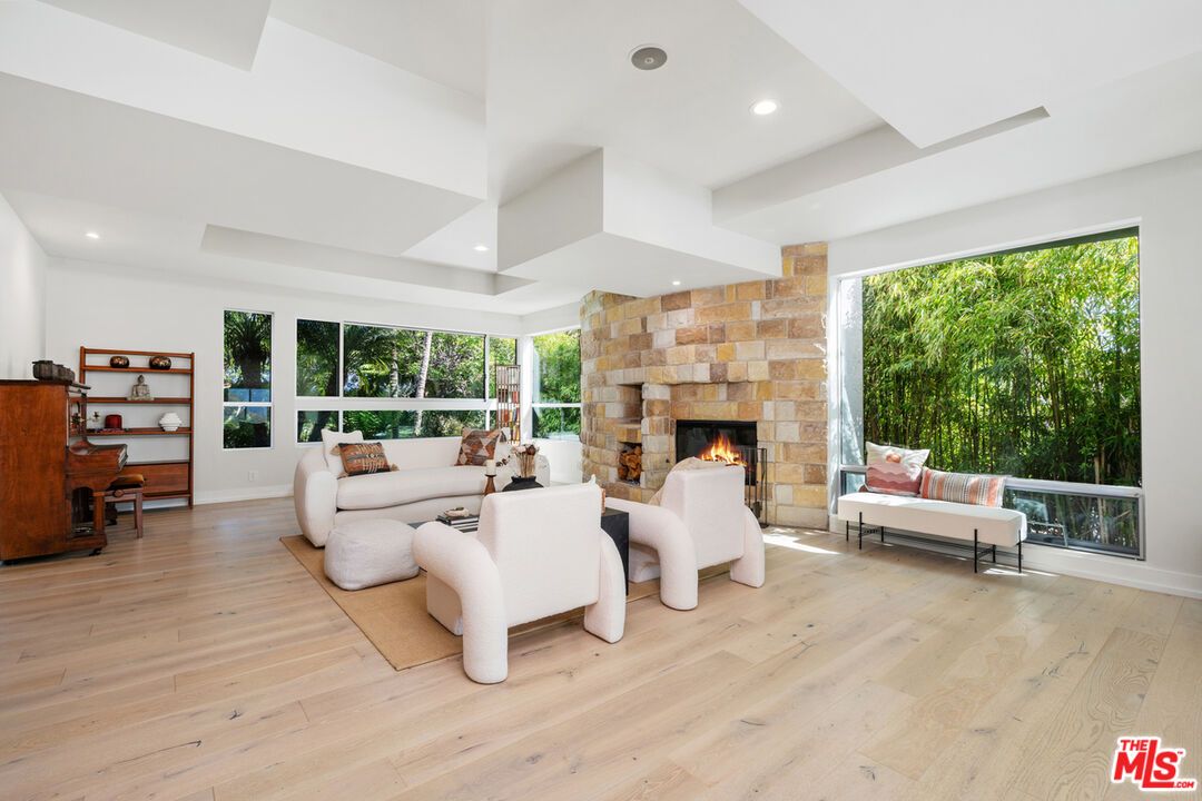 Fireplace, Interior, Living room, Piano, Recessed Lighting, Stone Walls, Wood Texture Flooring