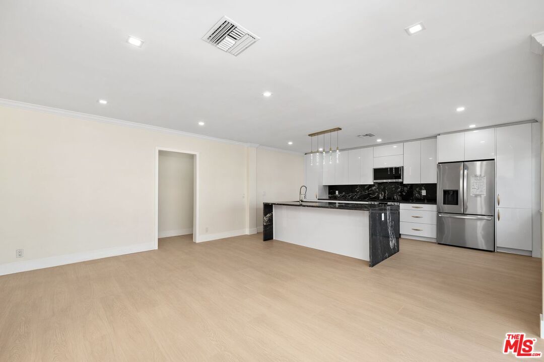 Interior, Kitchen, Marble Walls, Pendant Lights, Recessed Lighting, Stainless Steel Appliances, Wood Texture Flooring