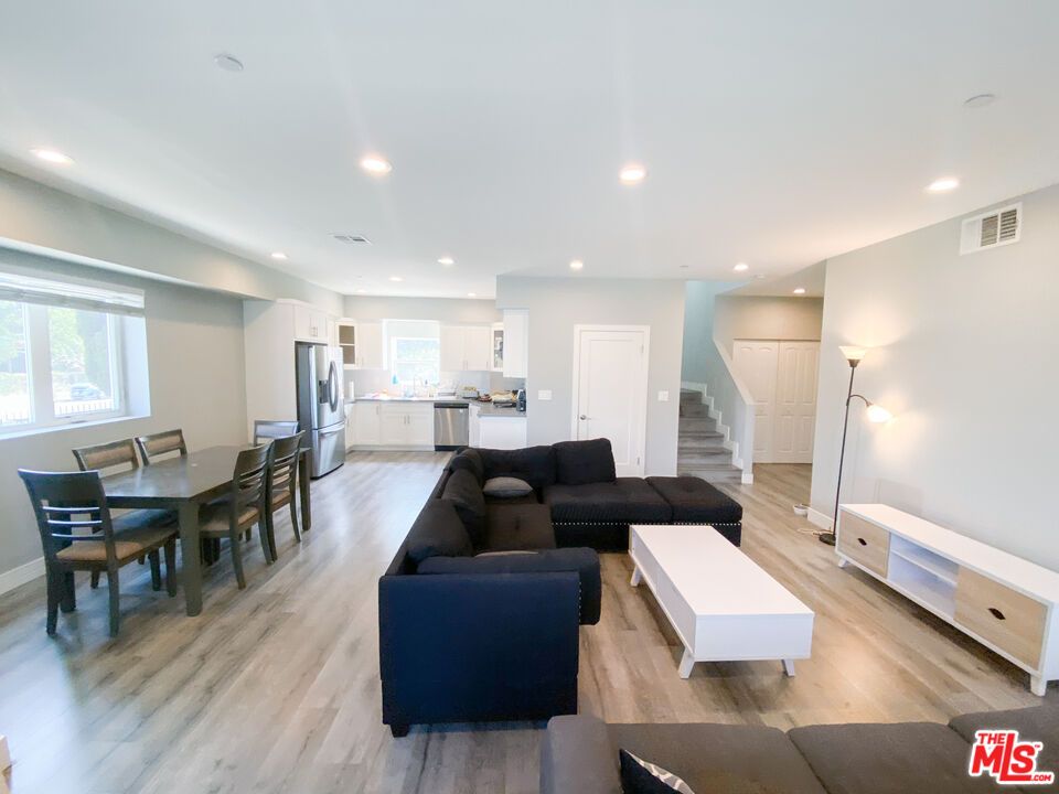 Dining room, Interior, Kitchen, Living room, Recessed Lighting, Stainless Steel Appliances, Wood Texture Flooring