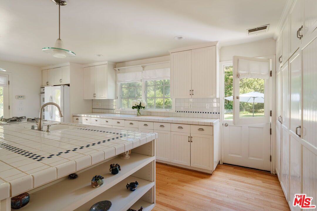 Interior, Kitchen, Pendant Lights, Recessed Lighting, Tile Countertops, Wood Texture Flooring