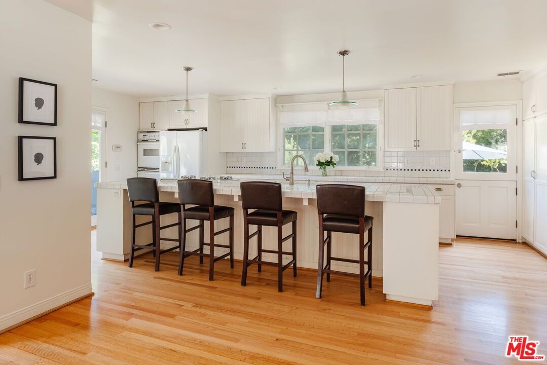 Interior, Kitchen, Pendant Lights, Recessed Lighting, Tile Countertops, Wood Texture Flooring