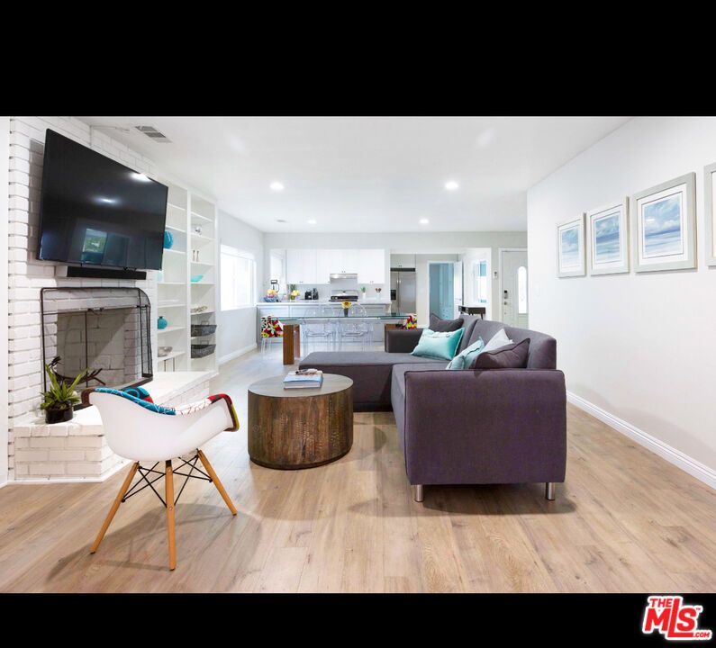 Fireplace, Interior, Kitchen, Living room, Recessed Lighting, Stone Walls, Wood Texture Flooring