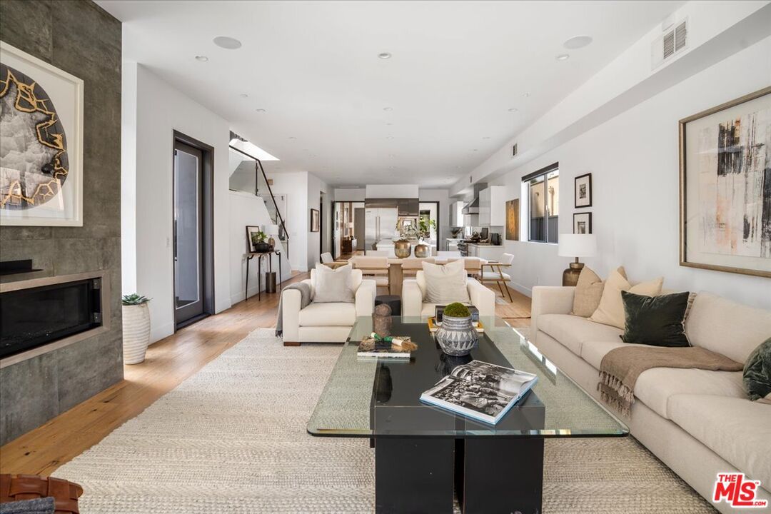 Dining room, Fireplace, Interior, Living room, Recessed Lighting, Wood Texture Flooring