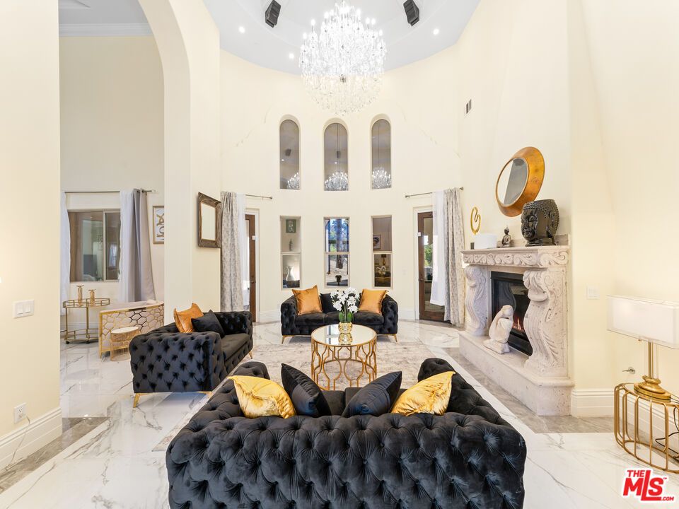Chandelier, Fireplace, Interior, Living room, Marble, Recessed Lighting