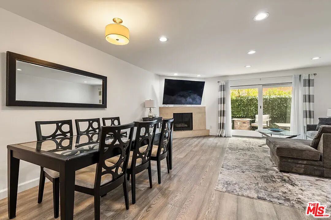 Dining room, Fireplace, Interior, Living room, Recessed Lighting, Wood Texture Flooring
