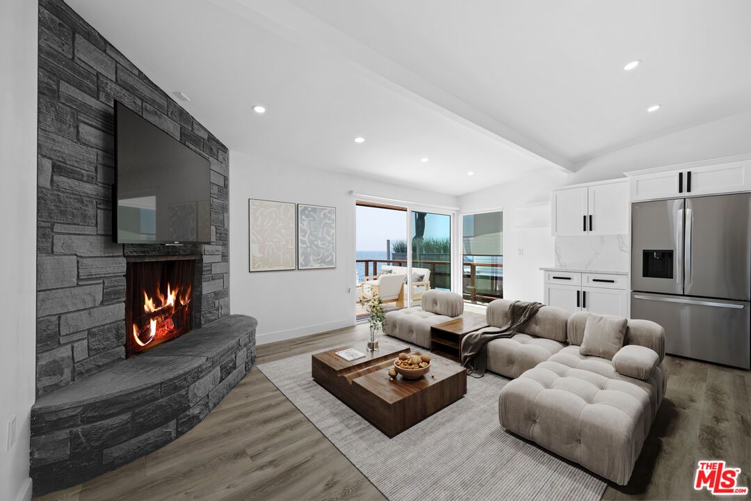 Fireplace, Interior, Kitchen, Living room, Recessed Lighting, Stainless Steel Appliances, Stone Walls, Wood Texture Flooring