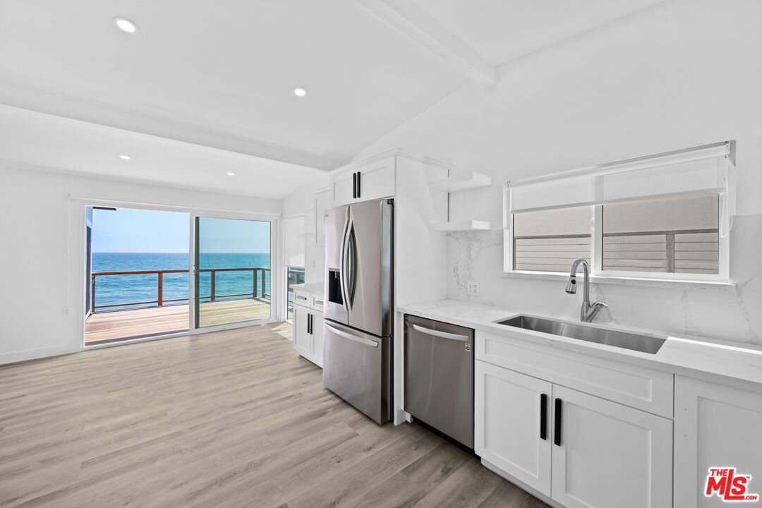 Interior, Kitchen, Marble Walls, Recessed Lighting, Stainless Steel Appliances, Water, Wood Texture Flooring