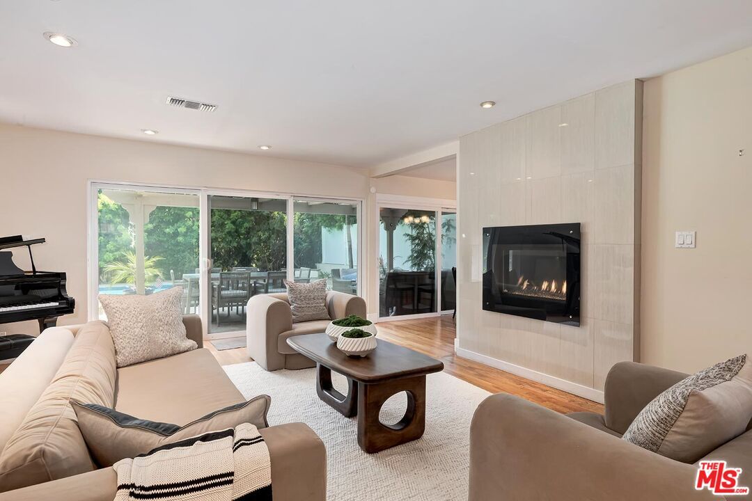 Fireplace, Interior, Living room, Piano, Recessed Lighting, Wood Texture Flooring