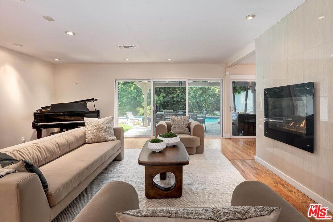 Fireplace, Interior, Living room, Piano, Recessed Lighting, Wood Texture Flooring