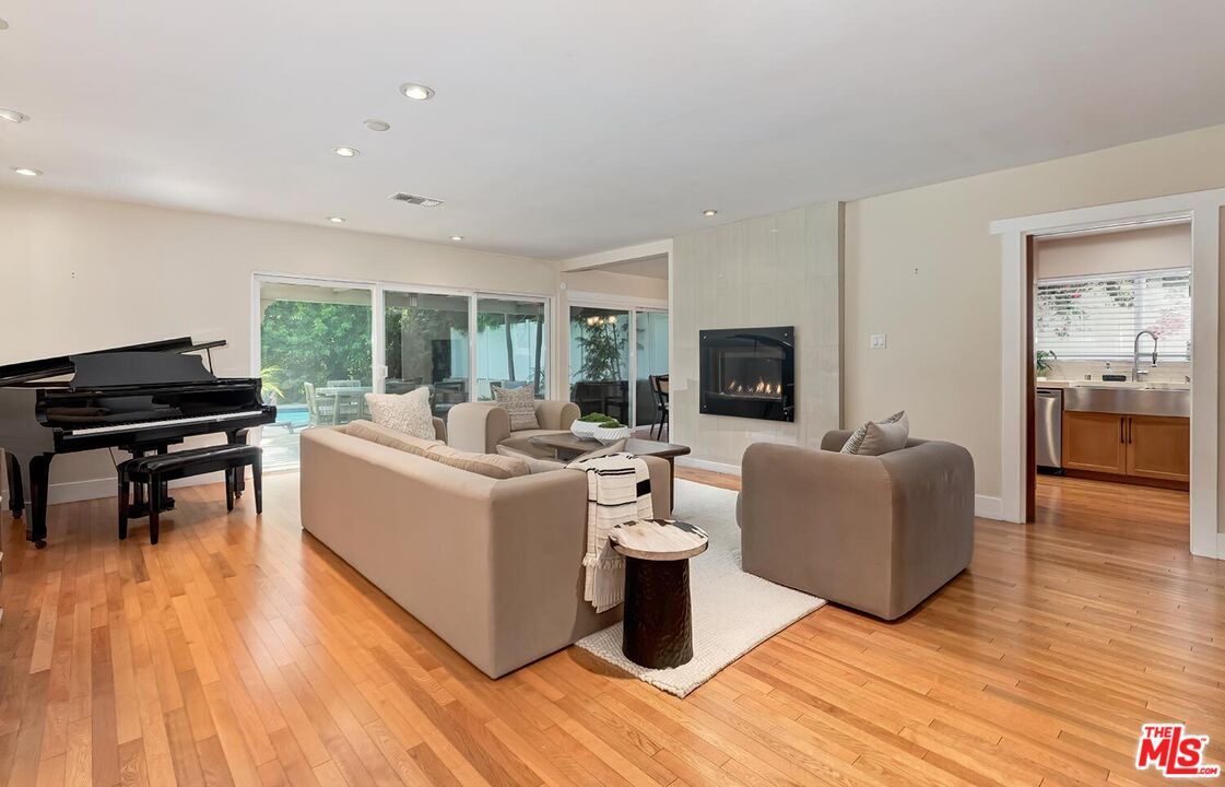 Fireplace, Interior, Living room, Piano, Recessed Lighting, Wood Texture Flooring