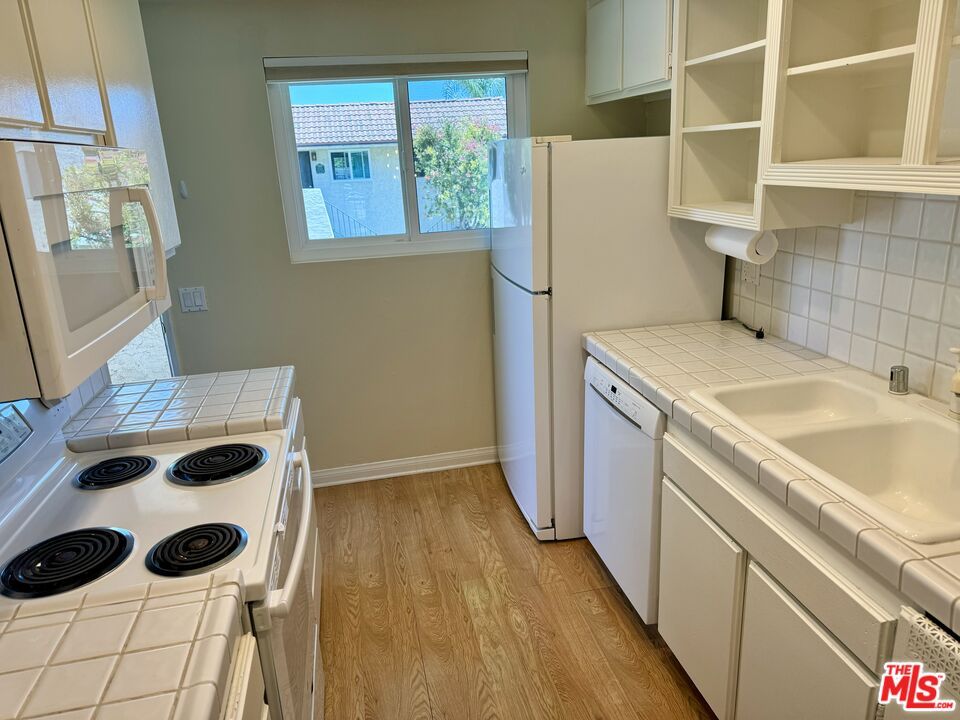 Interior, Kitchen, Tile Countertops, Wood Texture Flooring