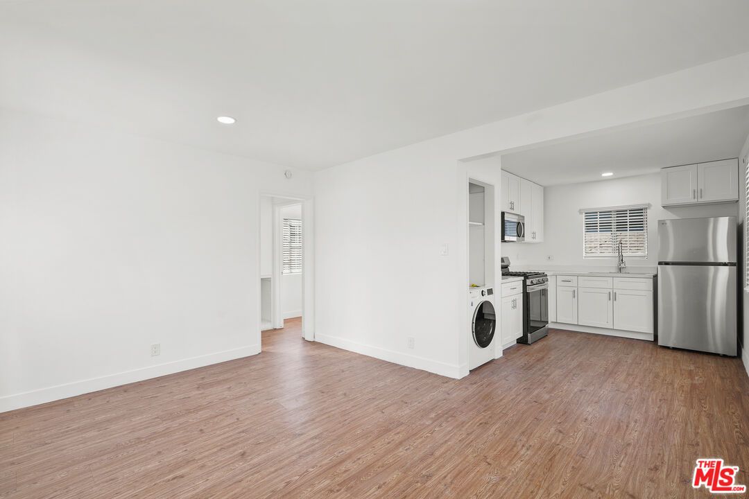 Interior, Kitchen, Recessed Lighting, Washer, Wood Texture Flooring