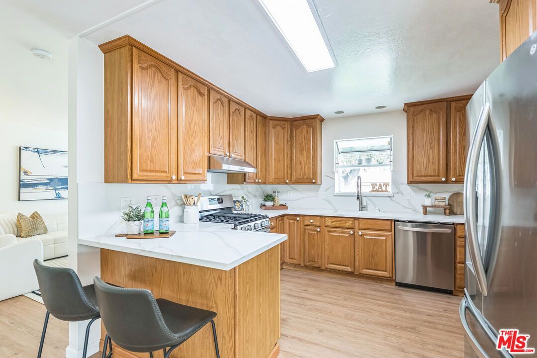 Interior, Kitchen, Marble Walls, Stainless Steel Appliances, Wood Texture Flooring