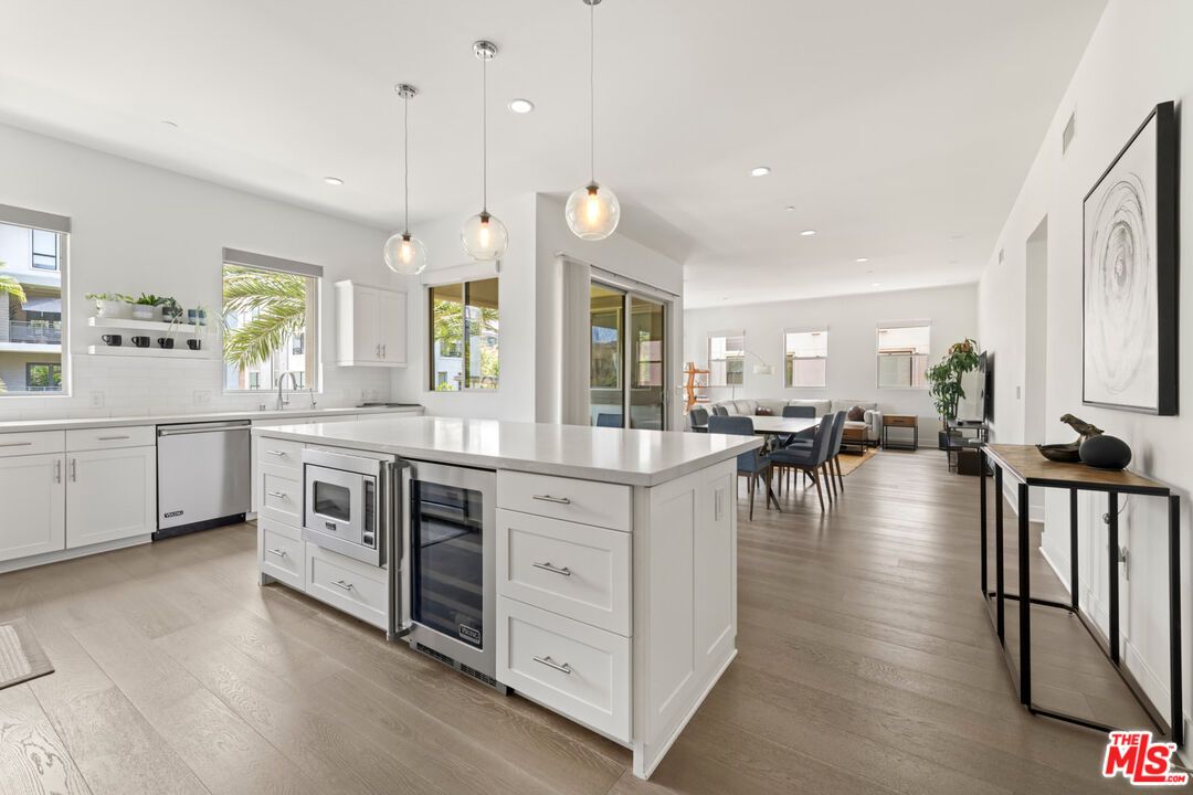 Dining room, Interior, Kitchen, Pendant Lights, Recessed Lighting, Stainless Steel Appliances, Wood Texture Flooring