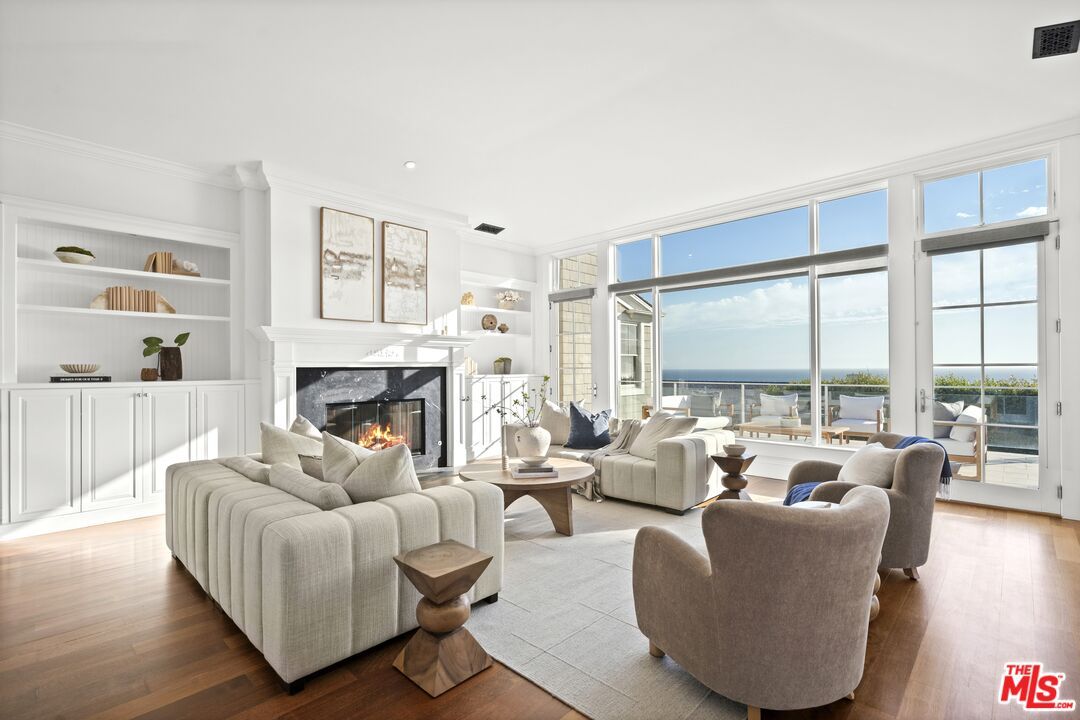 Fireplace, Interior, Living room, Recessed Lighting, Water, Wood Texture Flooring