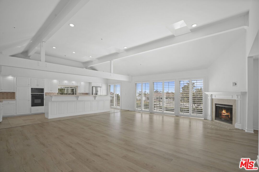 Empty room, Fireplace, Interior, Kitchen, Recessed Lighting, Wood Texture Flooring