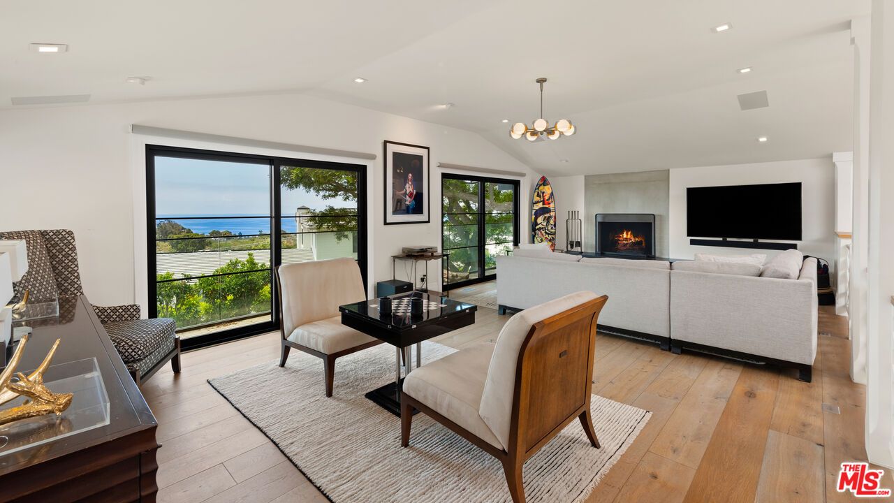 Fireplace, Interior, Living room, Pendant Lights, Recessed Lighting, Water, Wood Texture Flooring