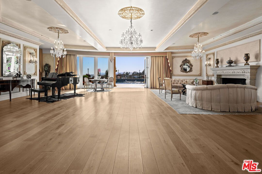 Chandelier, Fireplace, Interior, Living room, Piano, Recessed Lighting, Wood Texture Flooring