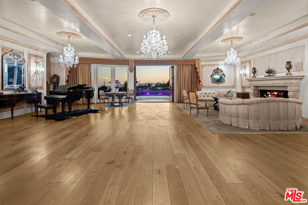 Chandelier, Fireplace, Interior, Living room, Piano, Recessed Lighting, Wood Texture Flooring