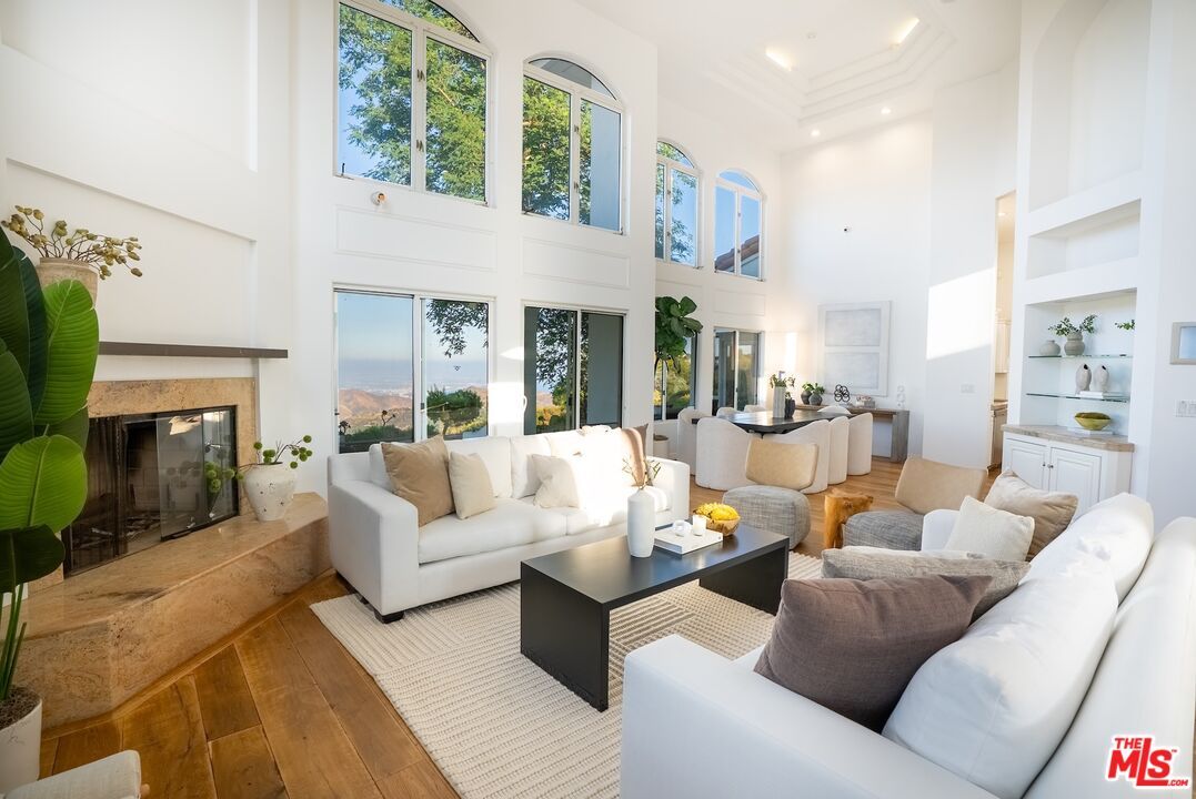 Dining room, Fireplace, Interior, Living room, Recessed Lighting, Wood Texture Flooring