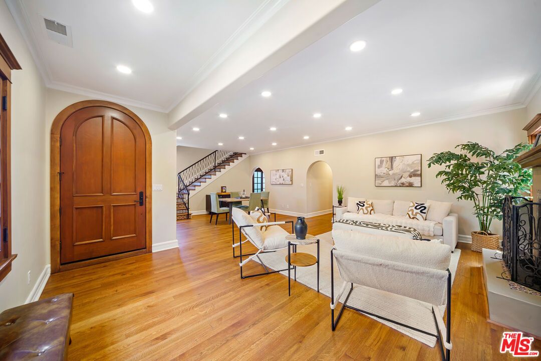 Dining room, Fireplace, Interior, Living room, Recessed Lighting, Wood Texture Flooring