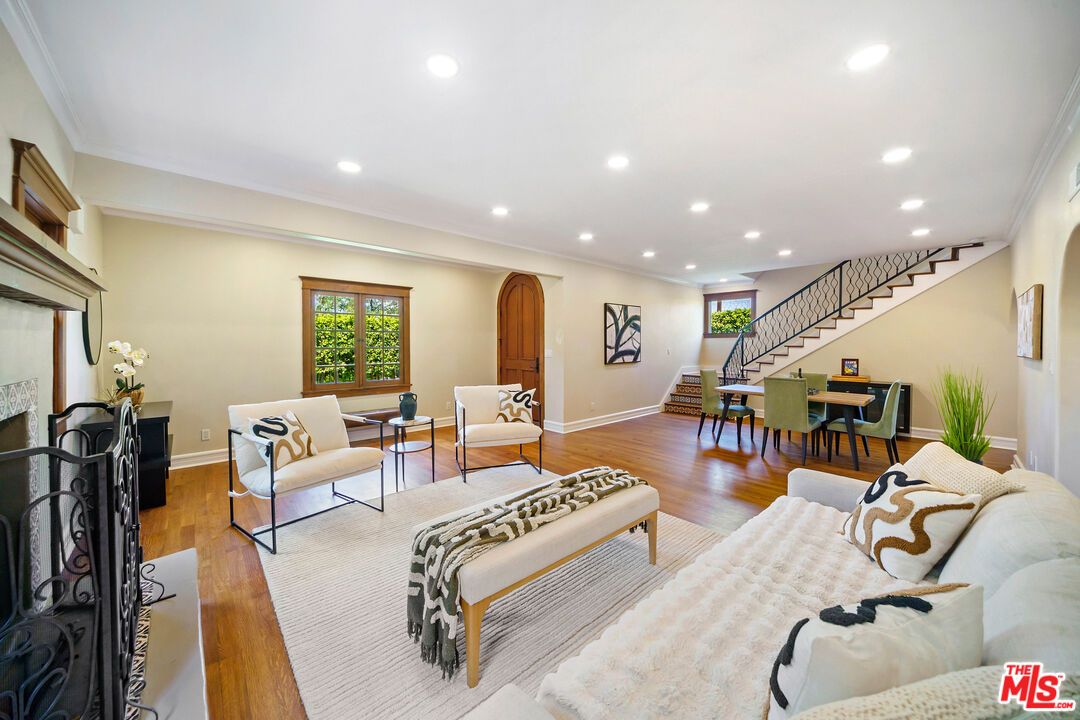 Dining room, Fireplace, Interior, Living room, Recessed Lighting, Wood Texture Flooring