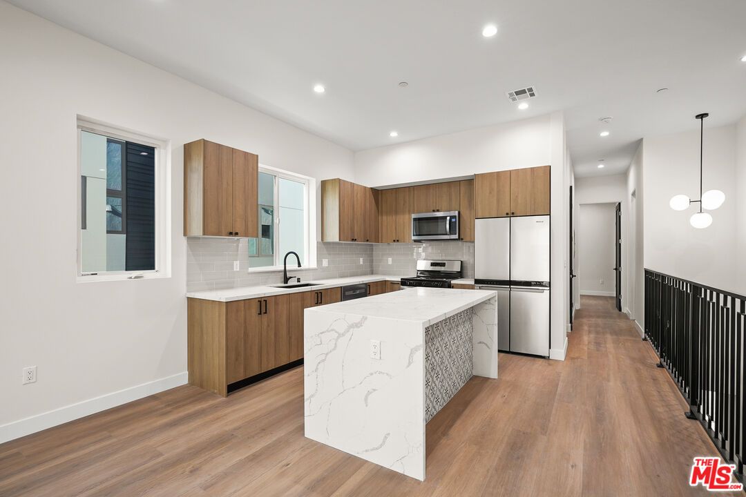 Interior, Kitchen, Pendant Lights, Recessed Lighting, Stainless Steel Appliances, Wood Texture Flooring