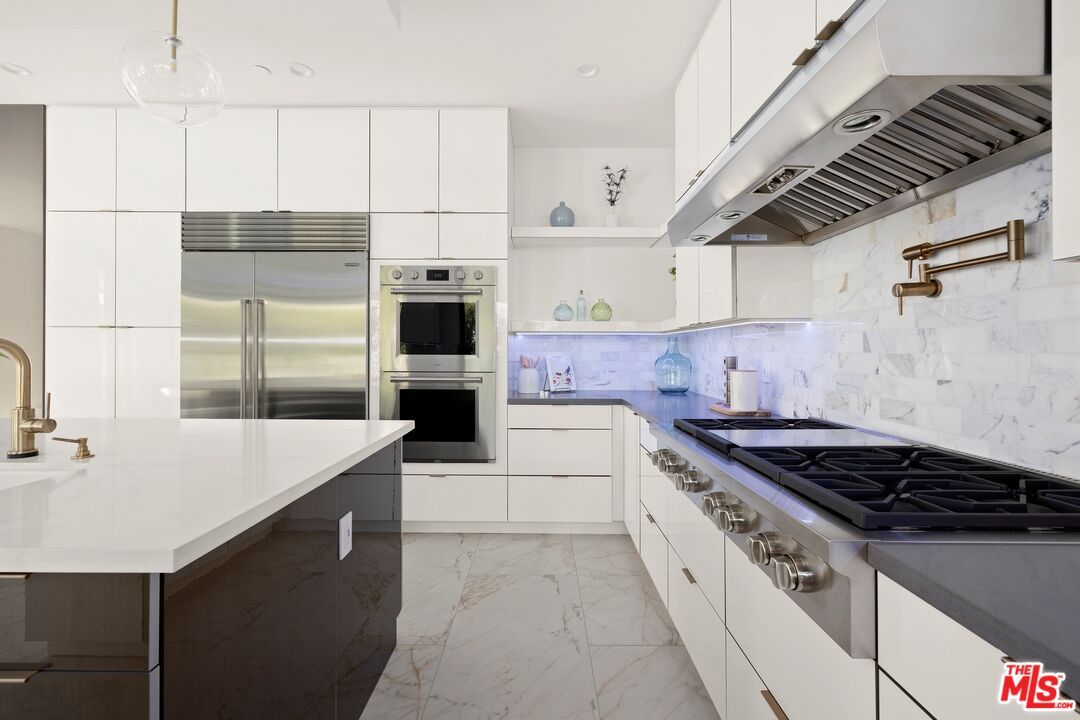 Interior, Kitchen, Marble, Marble Walls, Pendant Lights, Recessed Lighting, Stainless Steel Appliances