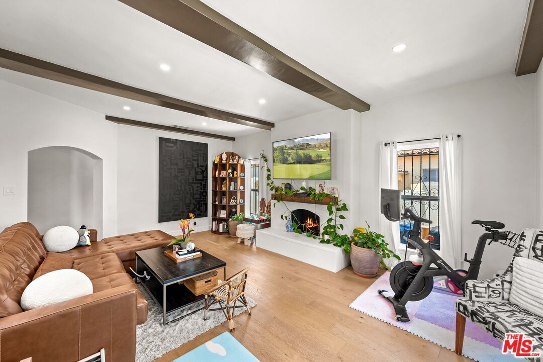 Fireplace, Fitness Equipment, Interior, Living room, Recessed Lighting, Wooden Beams, Wood Texture Flooring