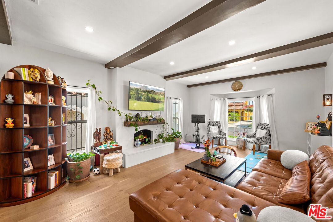 Fireplace, Fitness Equipment, Interior, Living room, Recessed Lighting, Wooden Beams, Wood Texture Flooring