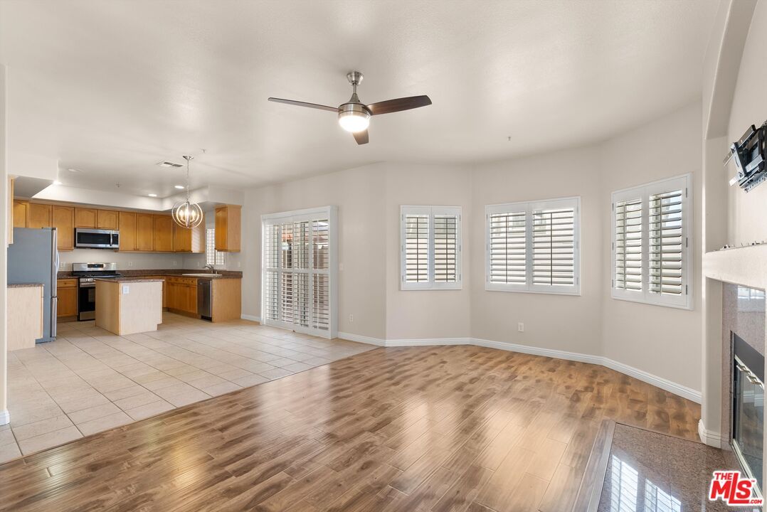 Fireplace, Interior, Kitchen, Pendant Lights, Recessed Lighting, Stainless Steel Appliances, Wood Texture Flooring